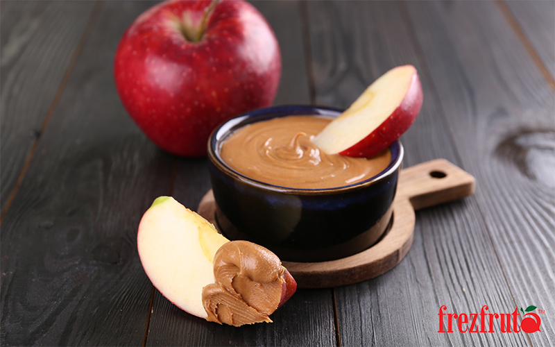 Slices of fresh apple with peanut butter